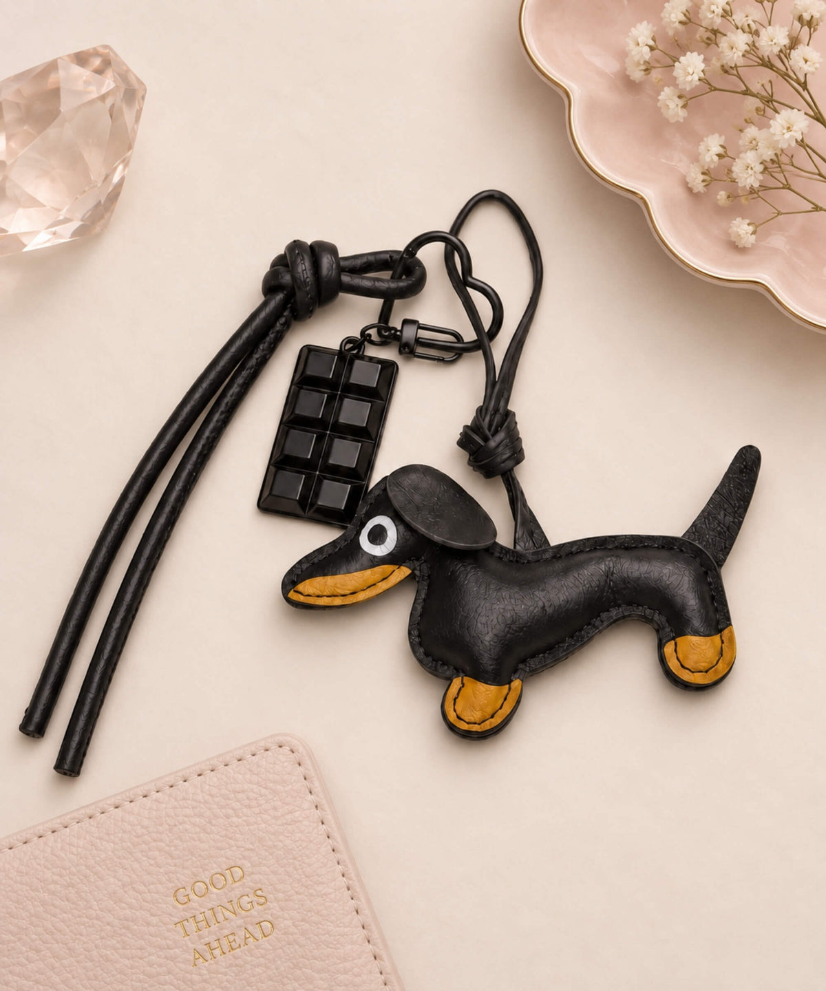 Black sausage dog PU leather bag charm keychain with chocolate bar charm and black wrist straps