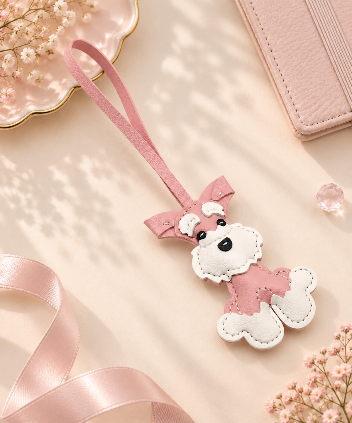 Pink and white Schnauzer PU leather bag charm keychain with long pink wrist strap and stitched dog details