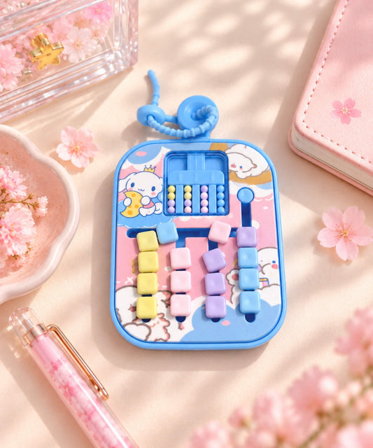 Cinnamoroll sliding bead maze game keychain styled on a desk