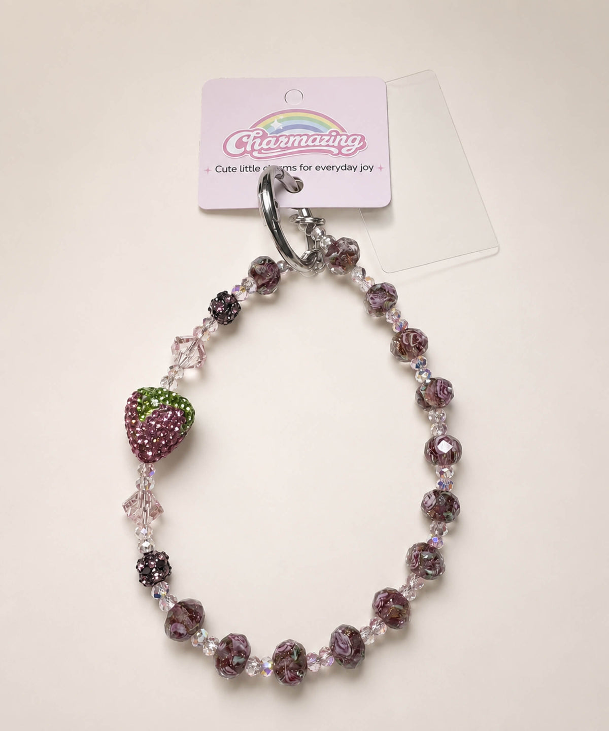 Dark purple strawberry beaded phone charm with mixed crystal-style beads and a sparkling strawberry charm