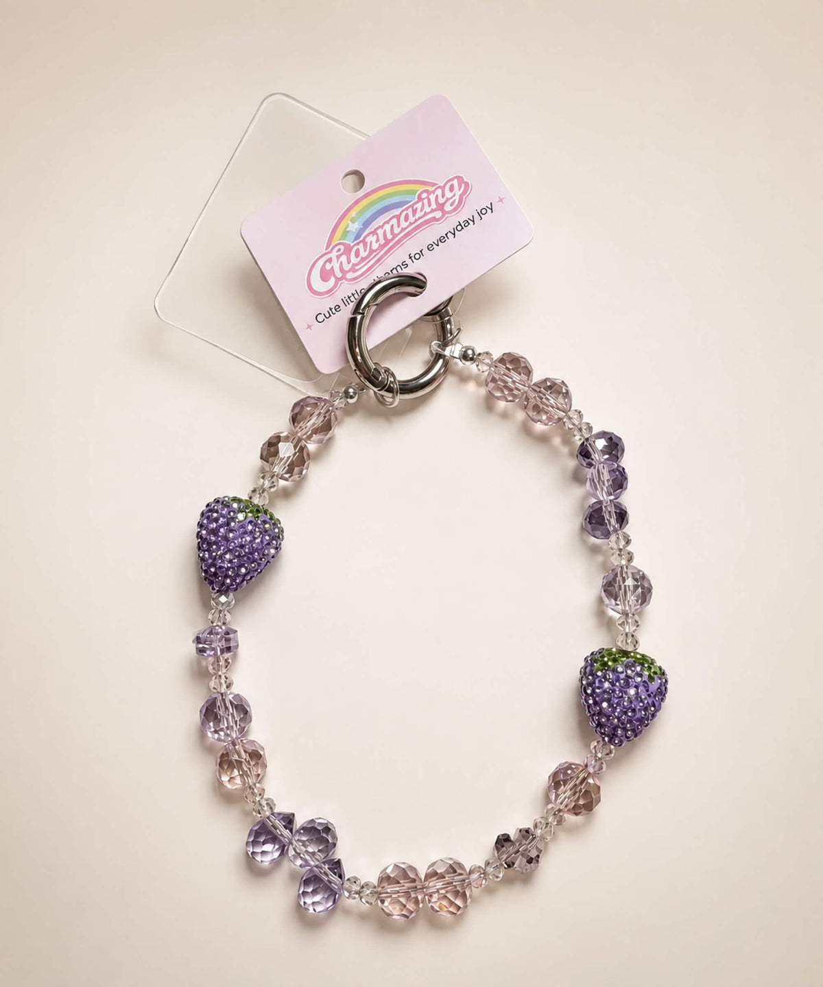 Light purple strawberry beaded phone charm with pastel crystal-style beads and sparkling strawberry details