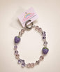 Light purple strawberry beaded phone charm with pastel crystal-style beads and sparkling strawberry details
