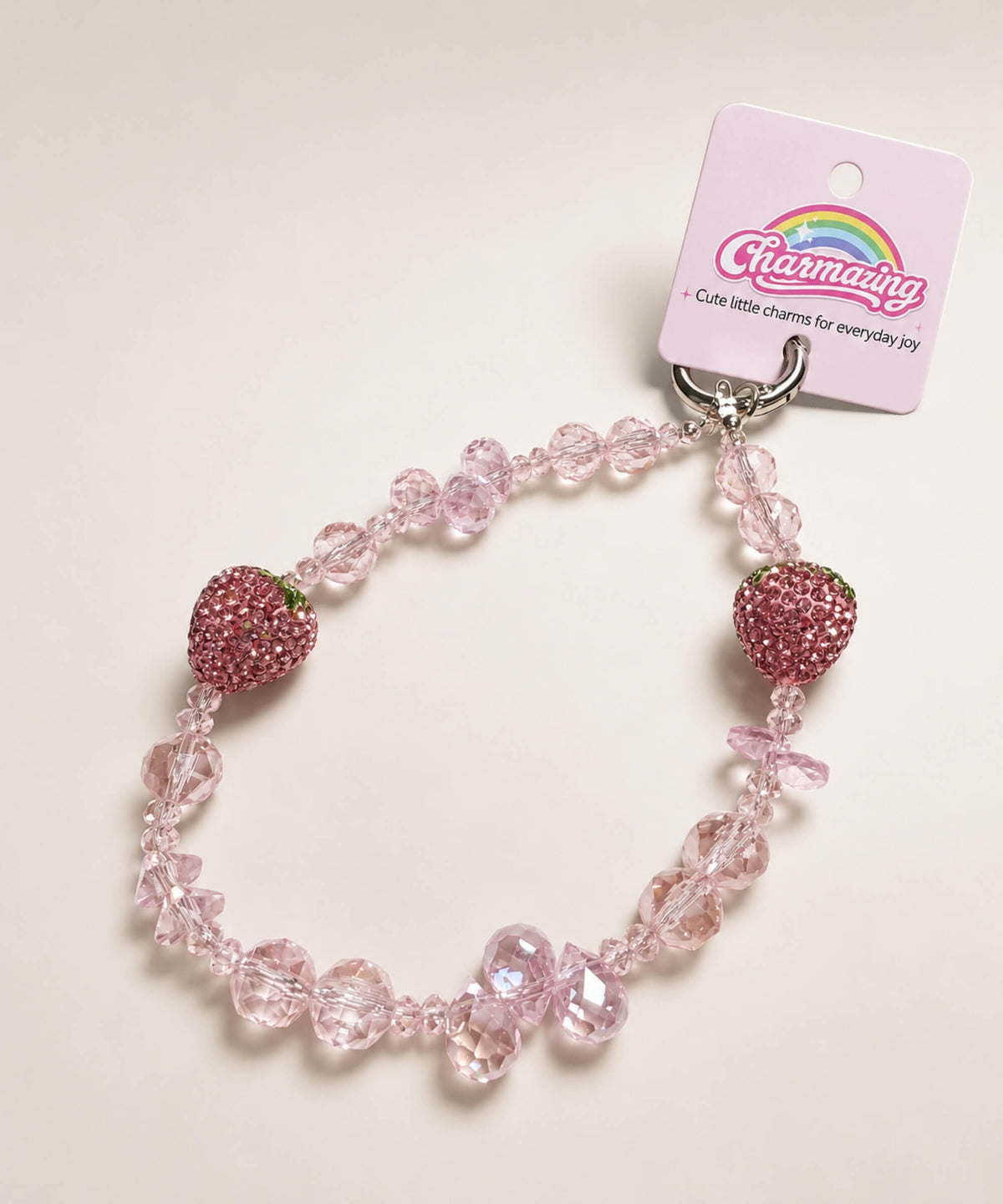 Pink strawberry beaded phone charm with crystal-style beads and sparkling strawberry accents
