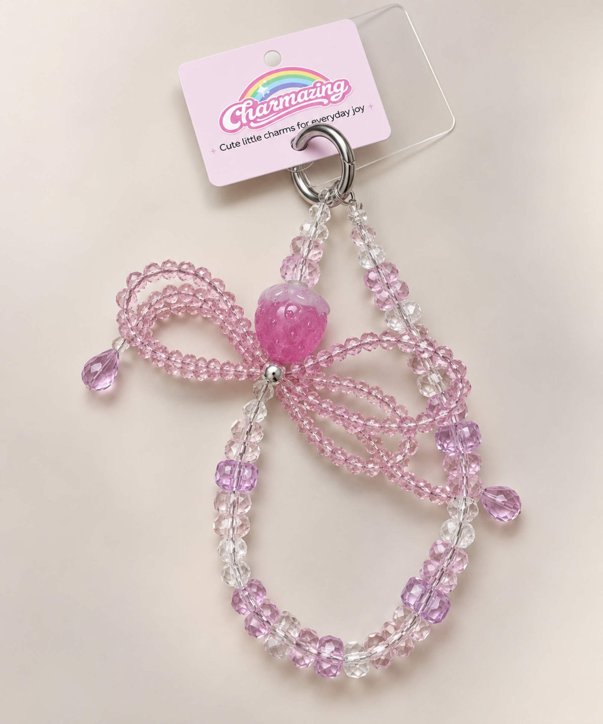 Pink strawberry bow beaded phone charm with crystal-style beads and bow detail