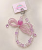 Pink strawberry bow beaded phone charm with crystal-style beads and bow detail