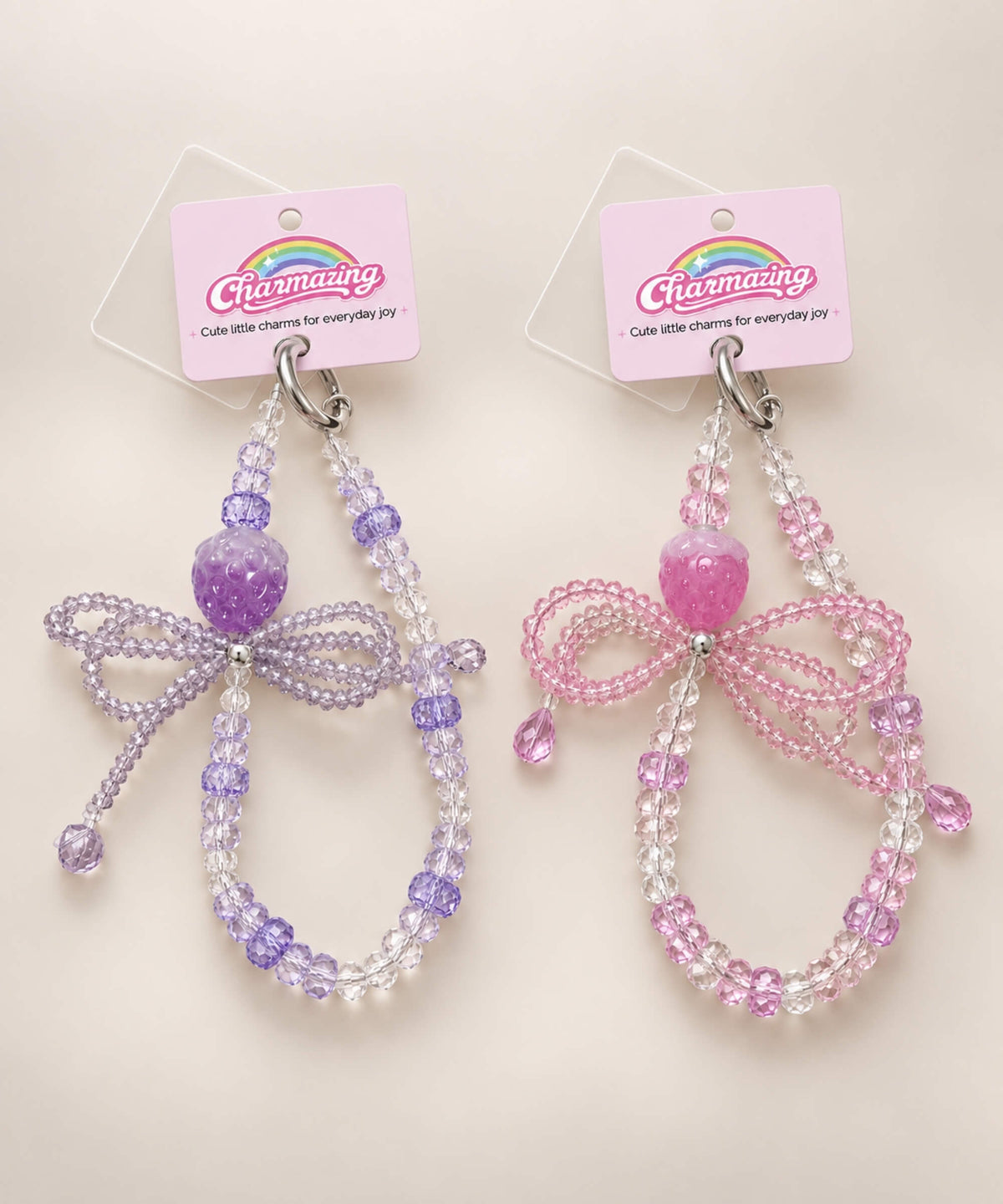 Strawberry bow beaded phone charm in pink and purple colour variants
