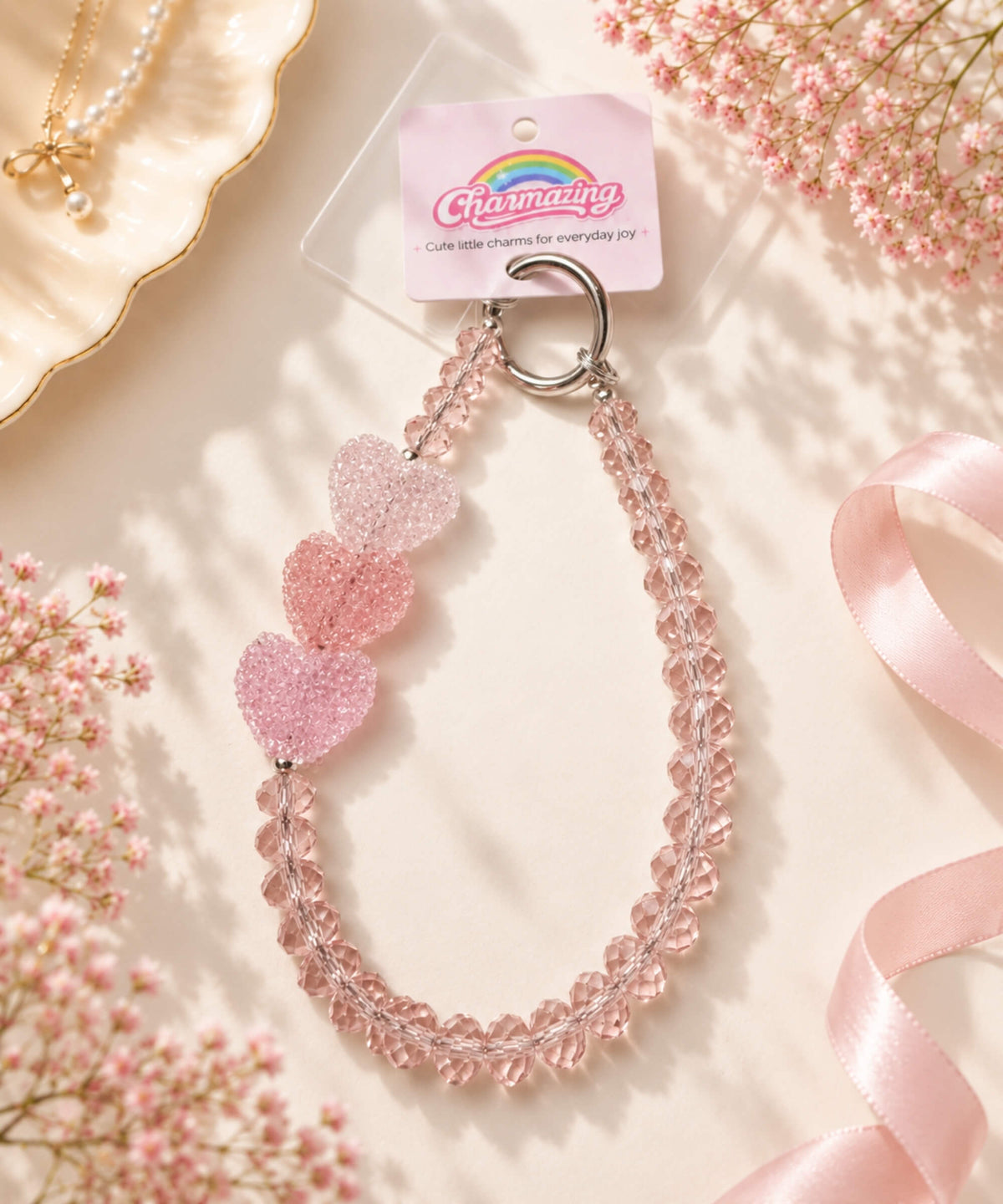 Close-up of triple pink heart accents on Triple Heart beaded phone charm
