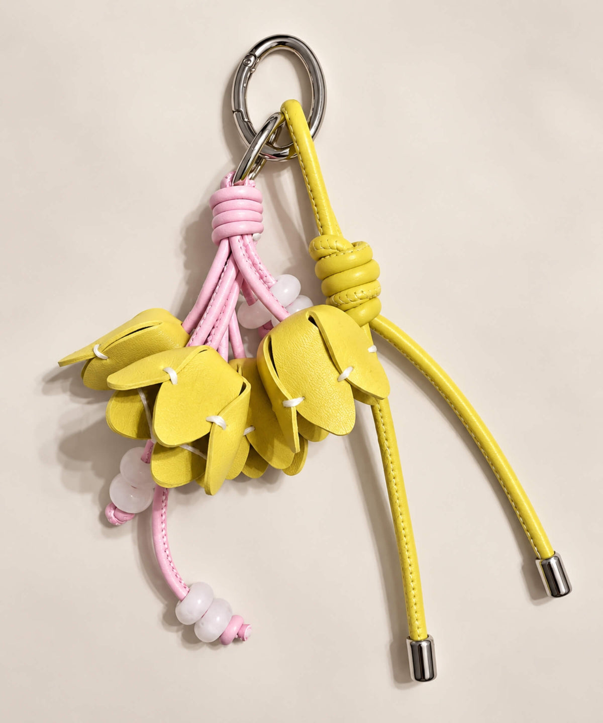 Yellow tulip PU leather bag charm keychain with layered flower buds and pink cord details