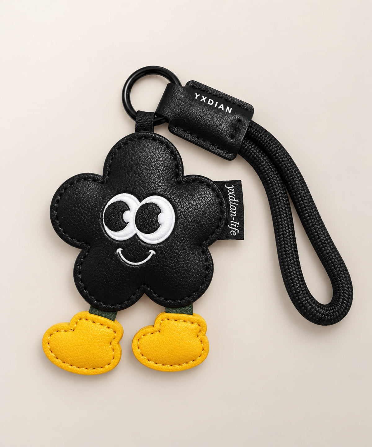 Black Flower PU leather bag charm keychain with cartoon eyes and yellow feet