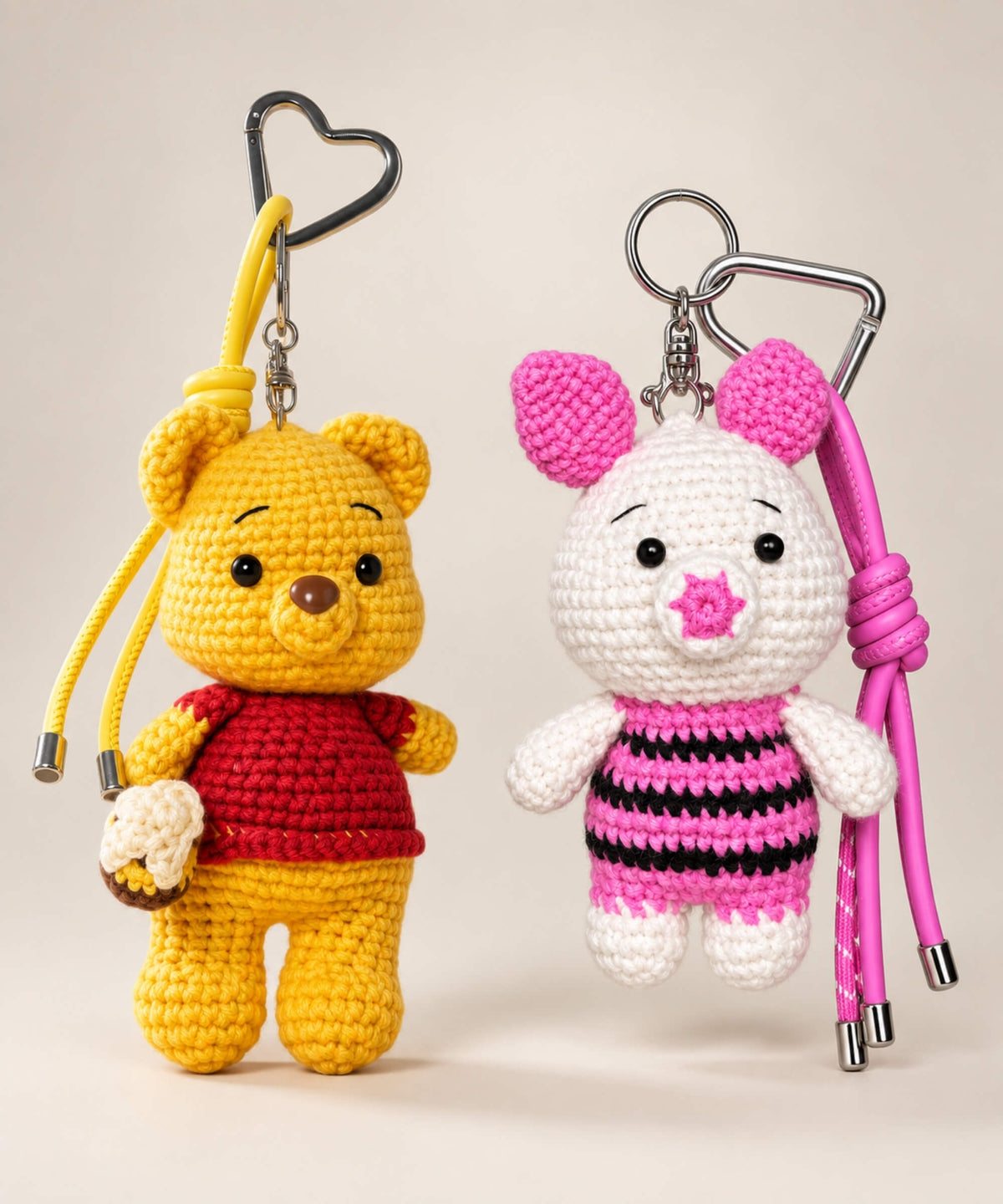 Winnie the Pooh and Piglet style crochet keychains with colourful straps