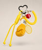 Yellow boxing glove and tennis rope keychain with tennis racket and ball charm