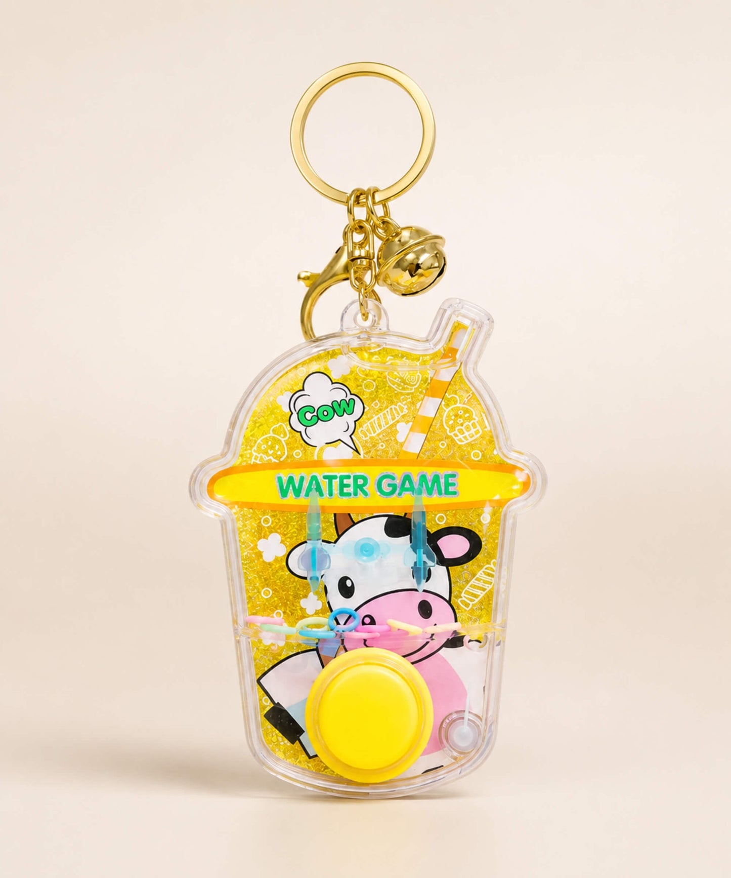Yellow cow water ring game keychain with button and bell charm