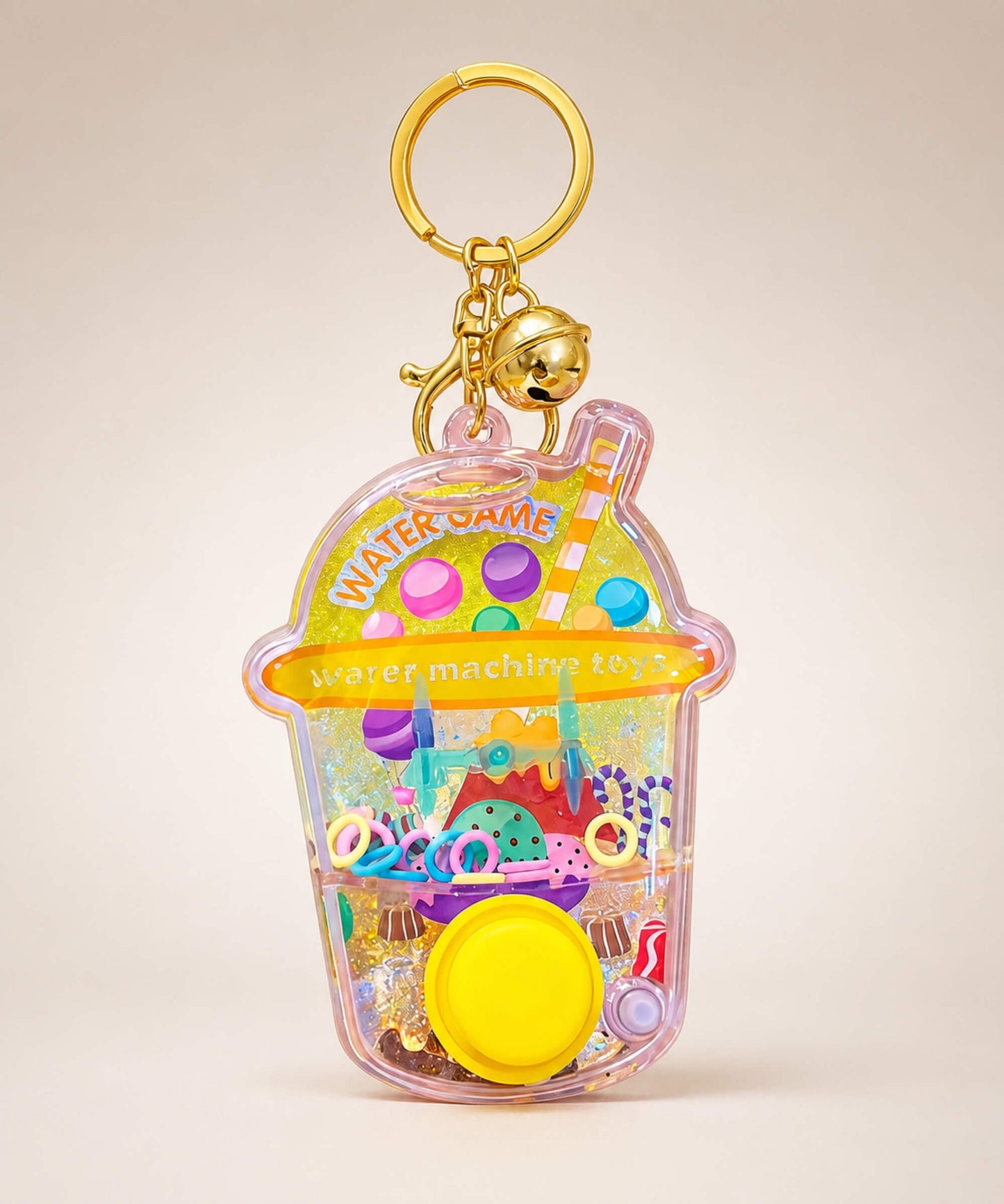 Yellow dessert water ring game keychain with button and gold bell